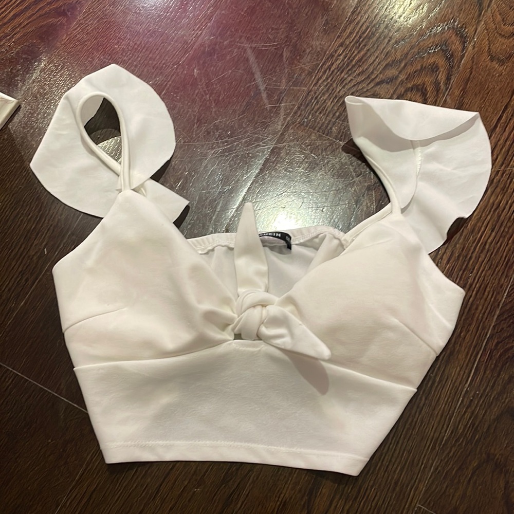 SHEIN USA M white crop top with ruffles and bowtie on chest.